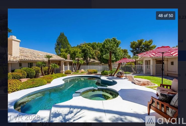A house with a pool in the backyard.