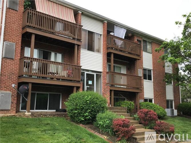 Apartment building with a balcony and a door.