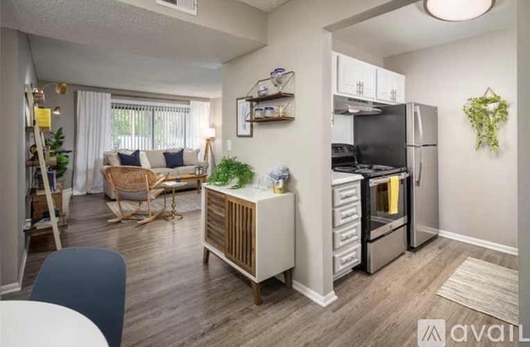 A kitchen with white cabinets and stainless steel appliances.