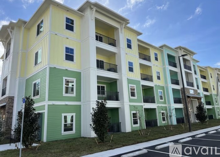 A row of multi-story buildings with balconies and windows.