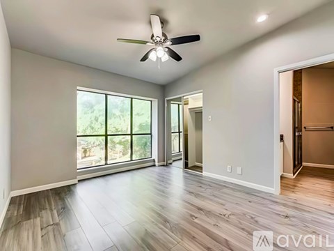 A kitchen with a stove top oven and microwave above it.