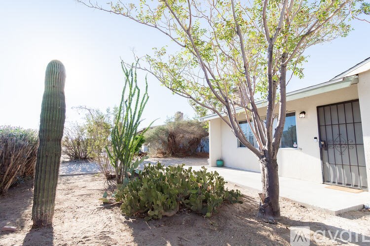 A house with a tree in front of it.