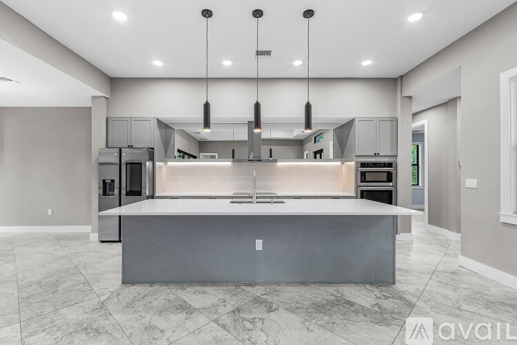 A modern kitchen with a large island in the center.