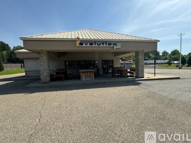 A car dealership with a large sign that says Avotion.
