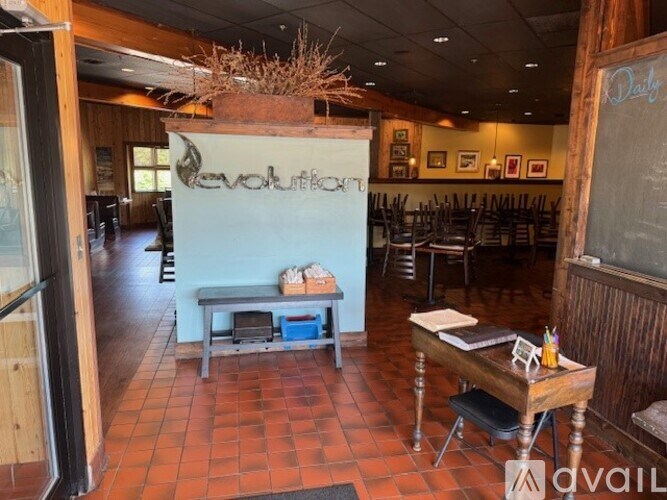 A restaurant with a sign that says "Evolution" on the wall.