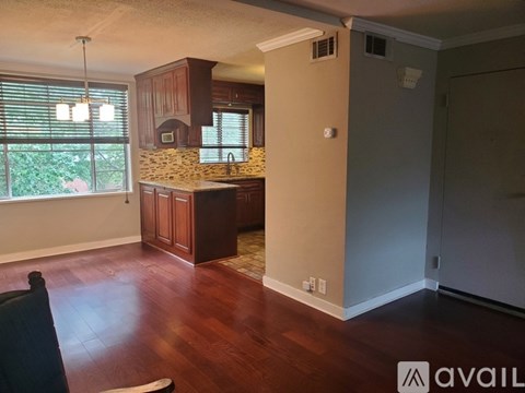A kitchen with wooden floors and a countertop.