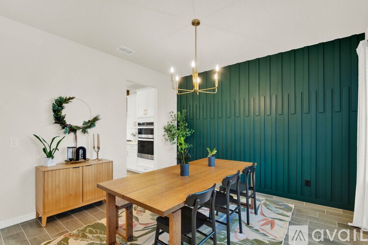 A dining area with a wooden table and chairs.