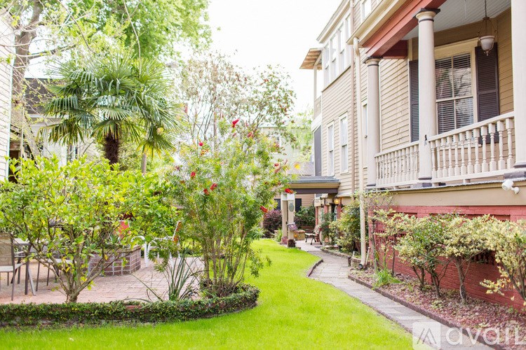 A well-maintained garden in front of a house.