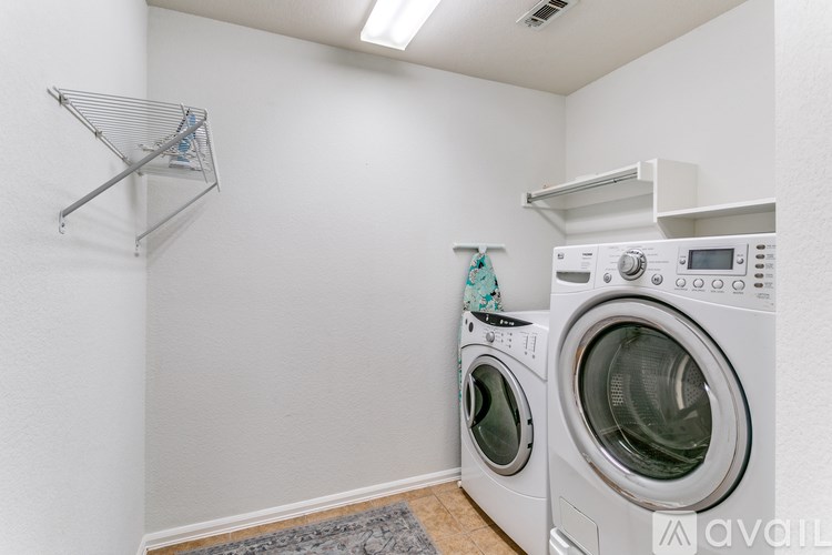 A laundry room with a washer and dryer.