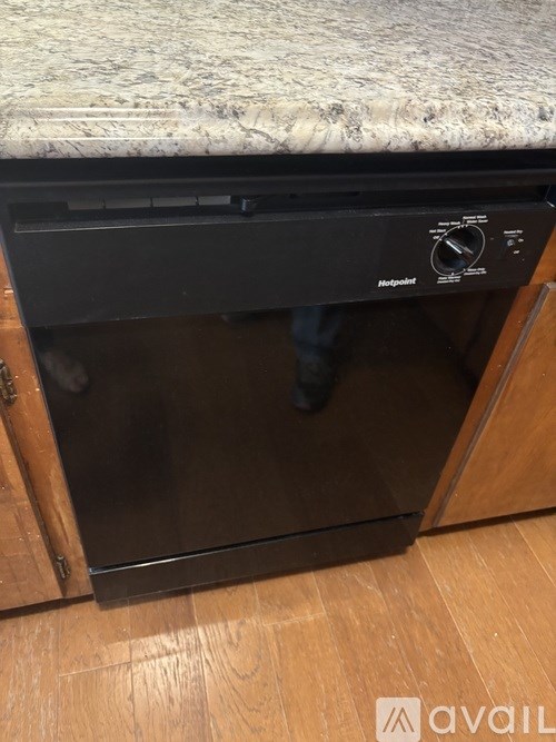 A Hotpoint oven is built into a kitchen counter.