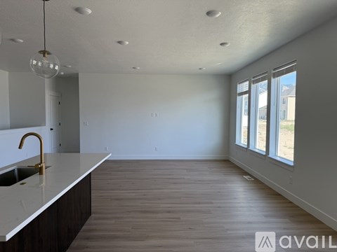A kitchen with a sink and a countertop is available for rent.