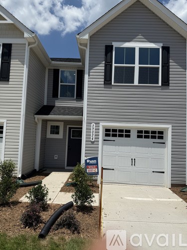 A house with a garage door that says "For Sale" is shown.
