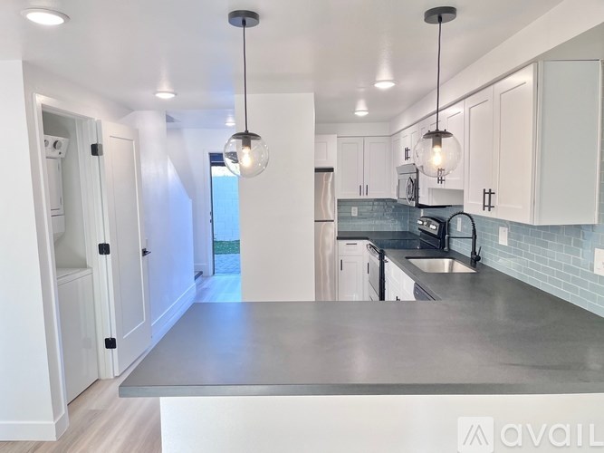 A modern kitchen with a large island in the center.