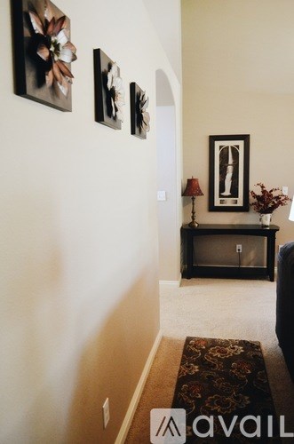 A living room with a couch and a television.