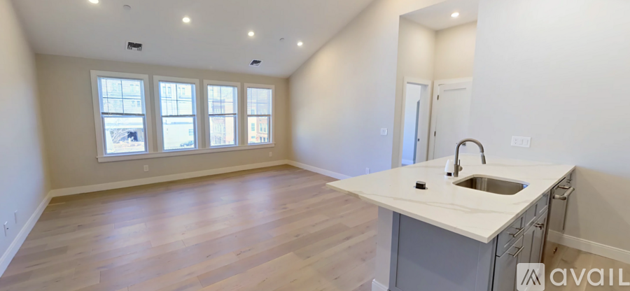 A kitchen area with a sink and a window.