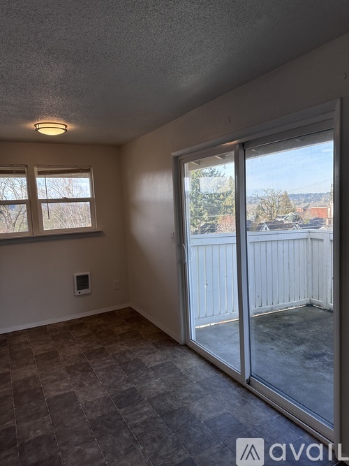 A blue door is on the left and a window is on the right.