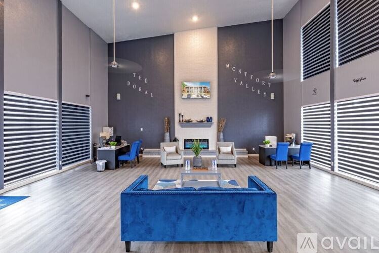 A living room with a blue sofa and a sign that says "The Portal".