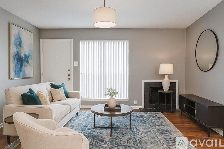 A room with a carpeted floor and a door leading to a window.