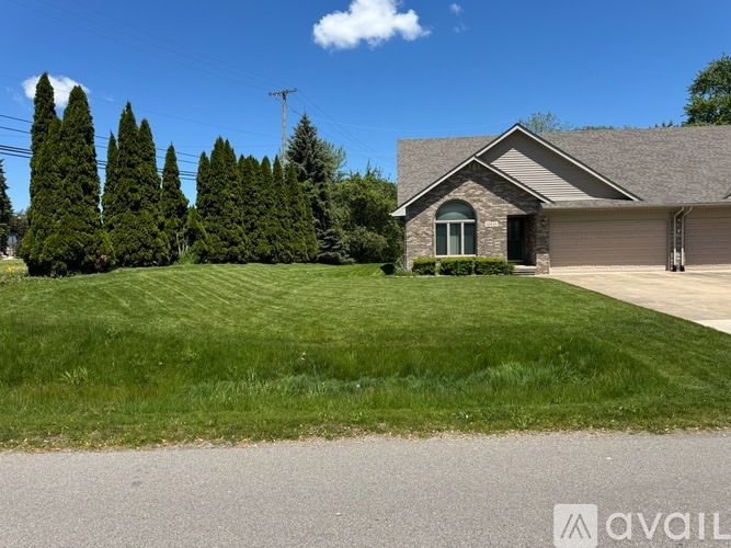 A house with a driveway in front of it.