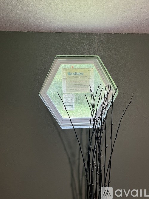 A sign with the word "Lease" on it is displayed in a window.