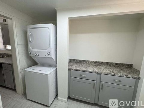 A white oven and microwave in a kitchen.