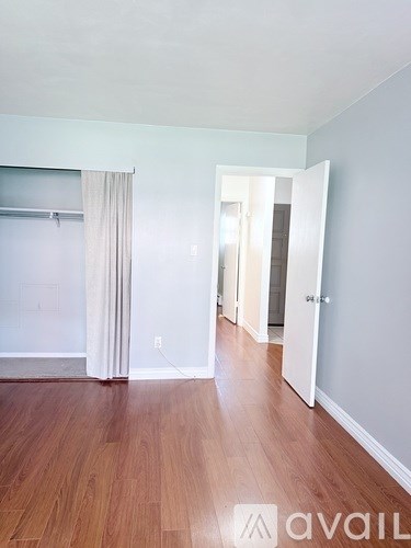 A room with a lamp and a window with blinds.