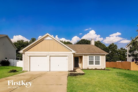 A two-car garage is attached to a house.