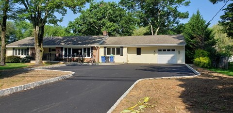 A house with a driveway and a garage.