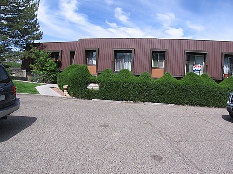 A building with a red roof and a sign on it.