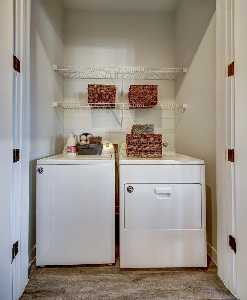 A small kitchen with a white fridge and a white freezer.