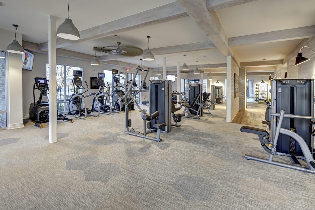 A spacious gym with a variety of exercise equipment.