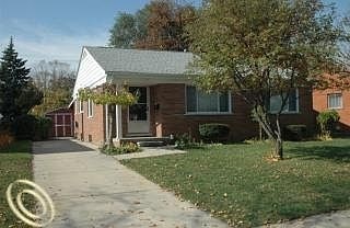 A house with a white door and a small porch.