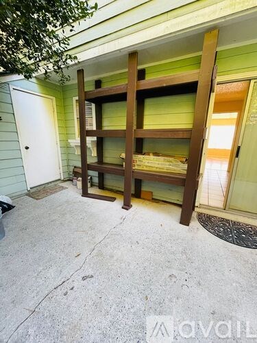 A bunk bed is in a room with green walls.