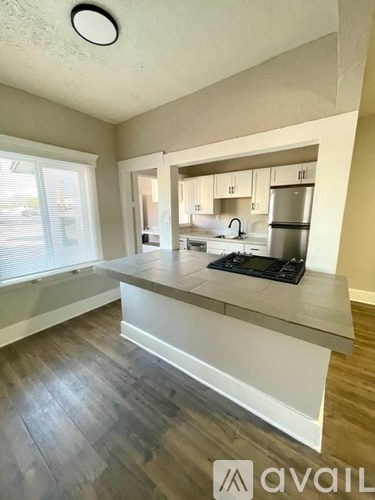 A modern kitchen with a large island in the middle.