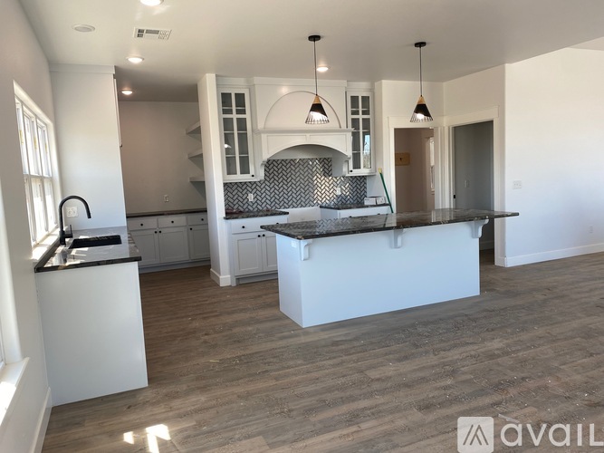 A modern kitchen with a large island in the middle.