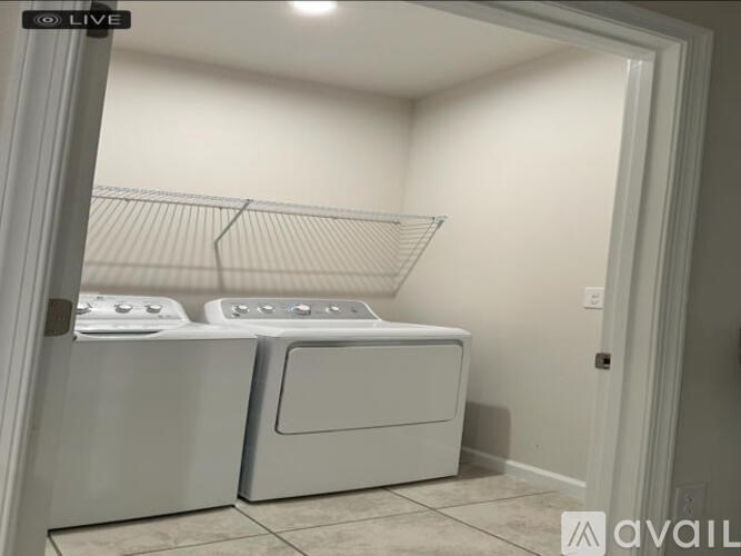 A laundry room with a washer and dryer.