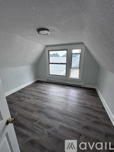 A room with a window and a door.