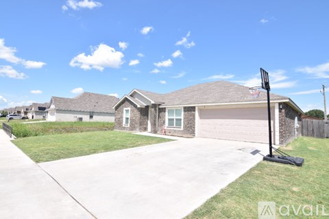 A house with a driveway and a sign that says "available".