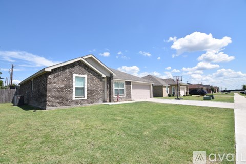A house with a lawn in front of it is for sale.