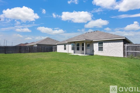 A house with a fence in front of it is for sale.