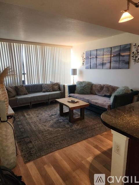 A living room with two couches and a coffee table.