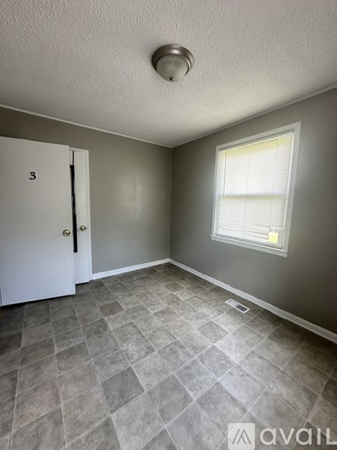 A room with a door and a window.