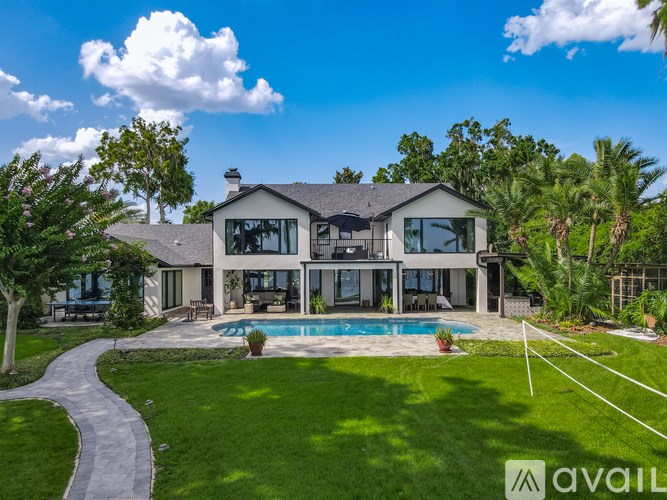 A large house with a pool in the backyard.