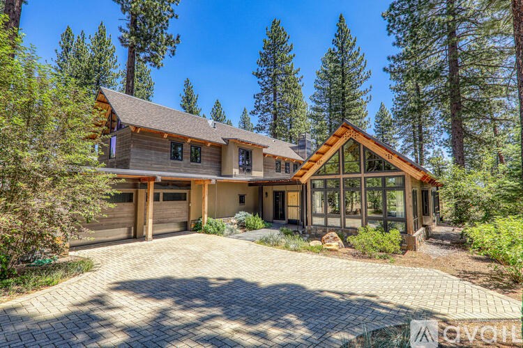 A large house with a driveway in front of it.