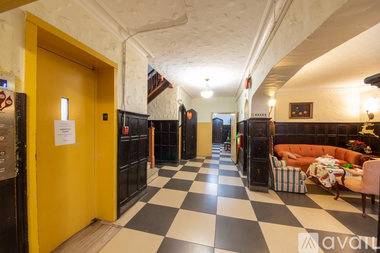 A hallway with a black and white checkered floor.