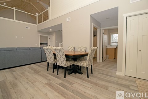 A kitchen with wooden floors and cabinets.