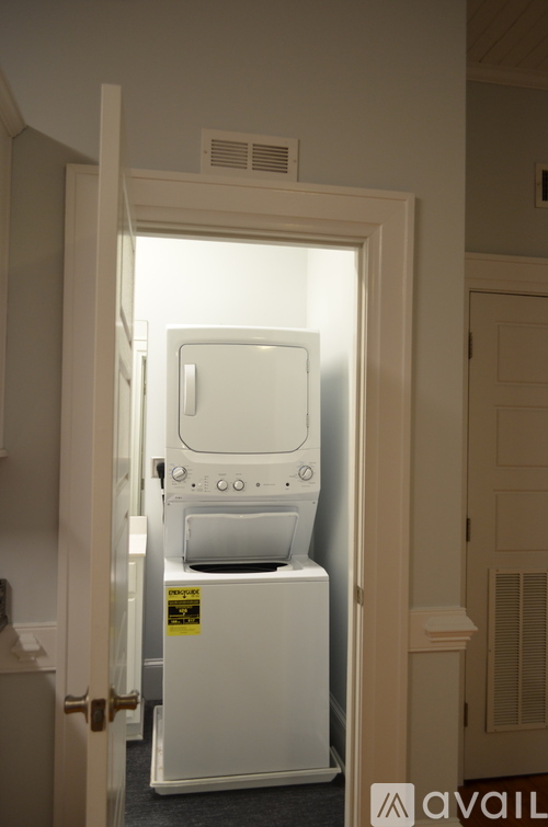 A white oven and dishwasher are in a doorway.
