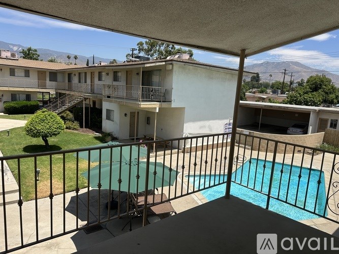 A balcony with a pool table and a pool.