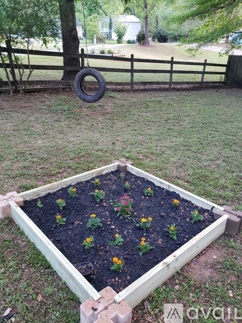 A garden bed with flowers planted in it.