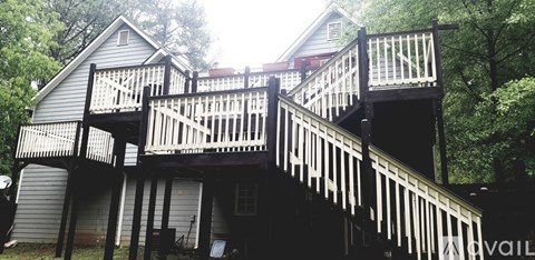 A house with a multi-level deck and stairs.